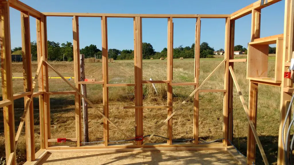 Pictured is a timber house frame showing braces and noggins.  An advantage of hempcrete is its rigidity - meaning these braces were probably not necessary.