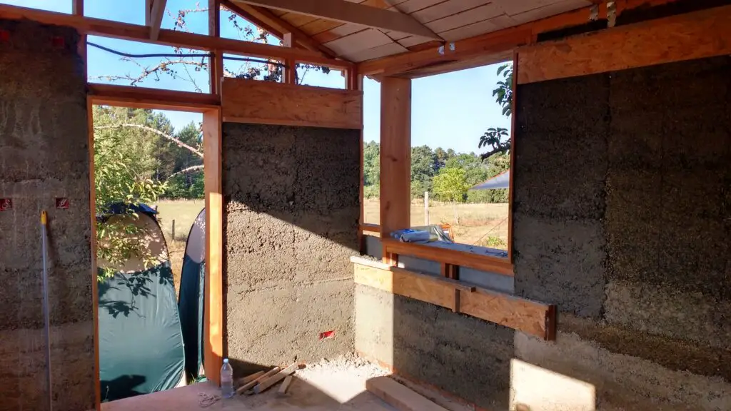 Pictured is a partially complete timber and hempcrete wall