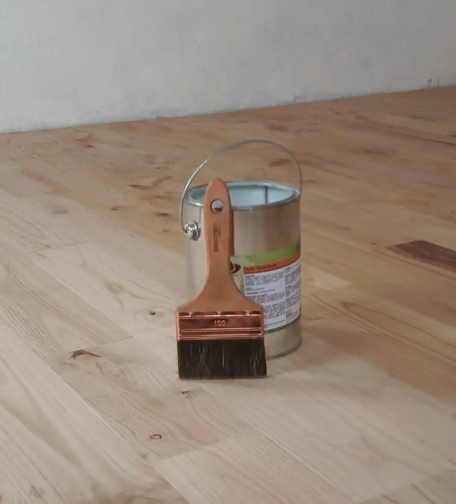 Pictured is the tiny house floor oil and brush