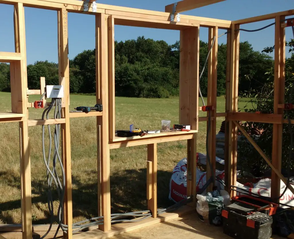Pictured is the electrical circuits being installed in a tiny house frame