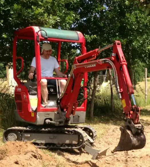 Pictured is a mini digger in use