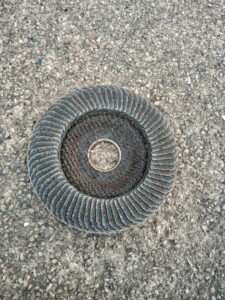 Pictured is an abrasive wheel