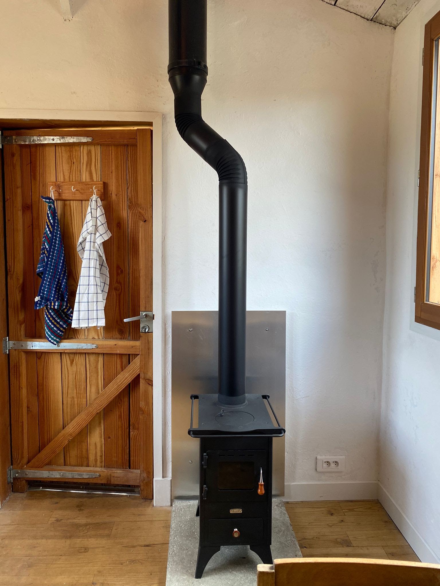 Pictured is the completed wood burning stove installaion